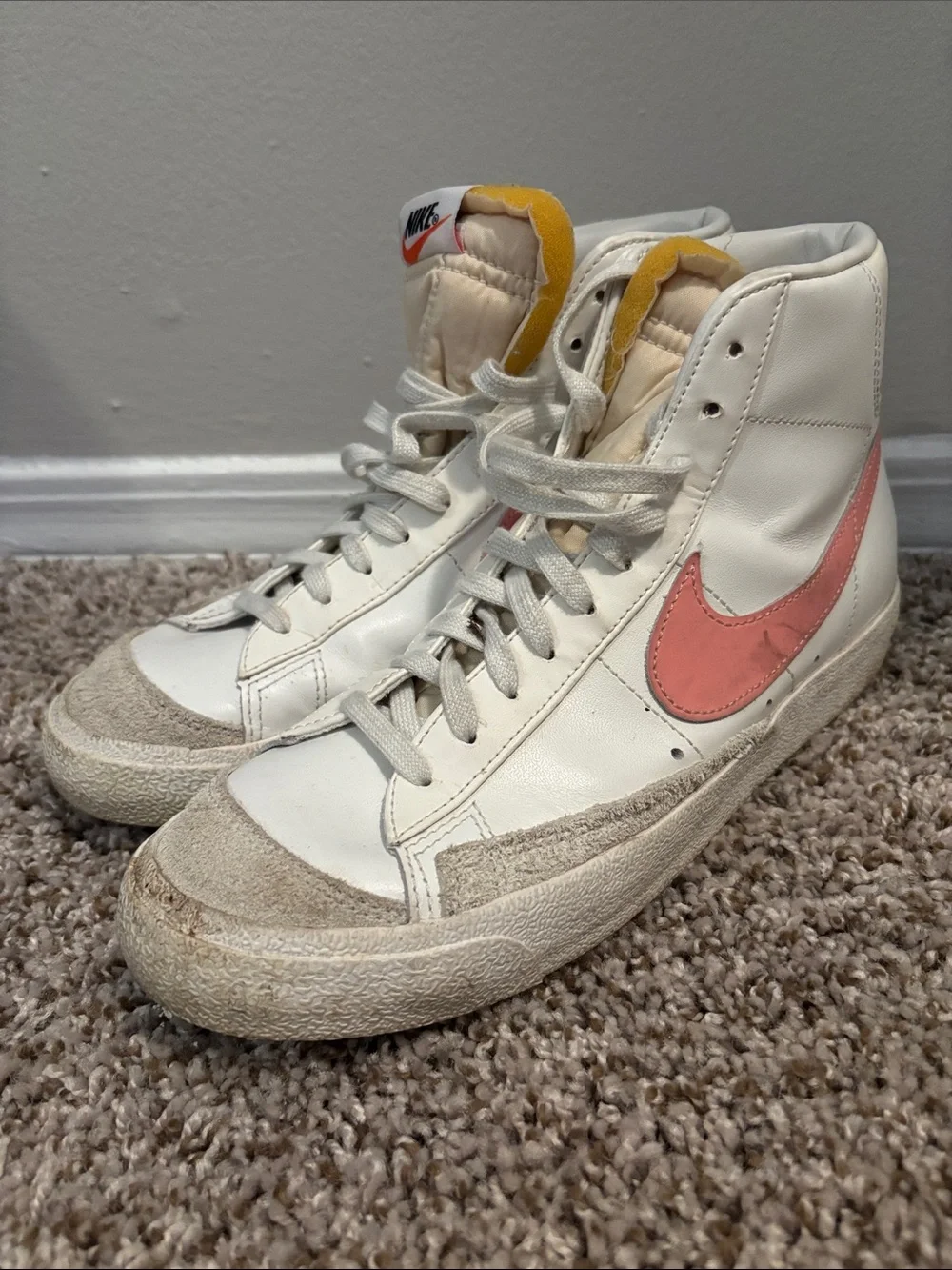 Nike Women's High-Top Sneakers in White with Pink Swoosh